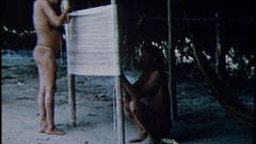 A Man and His Wife Weave a Hammock